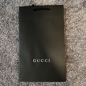 Black Gucci shopping bag